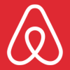 A red and white logo of an airbnb.