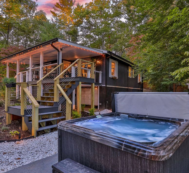 A hot tub in the middle of a yard.