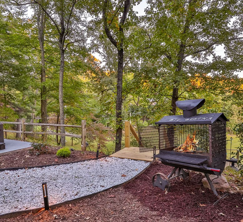 A fire pit in the middle of a forest.