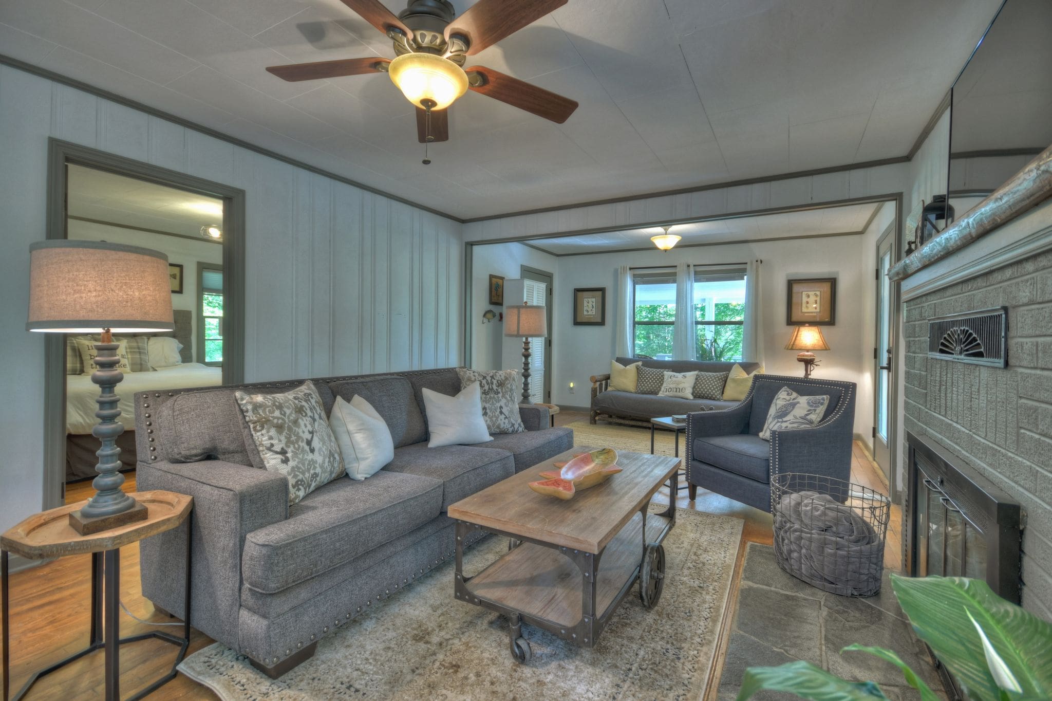 A living room with couches and chairs in it