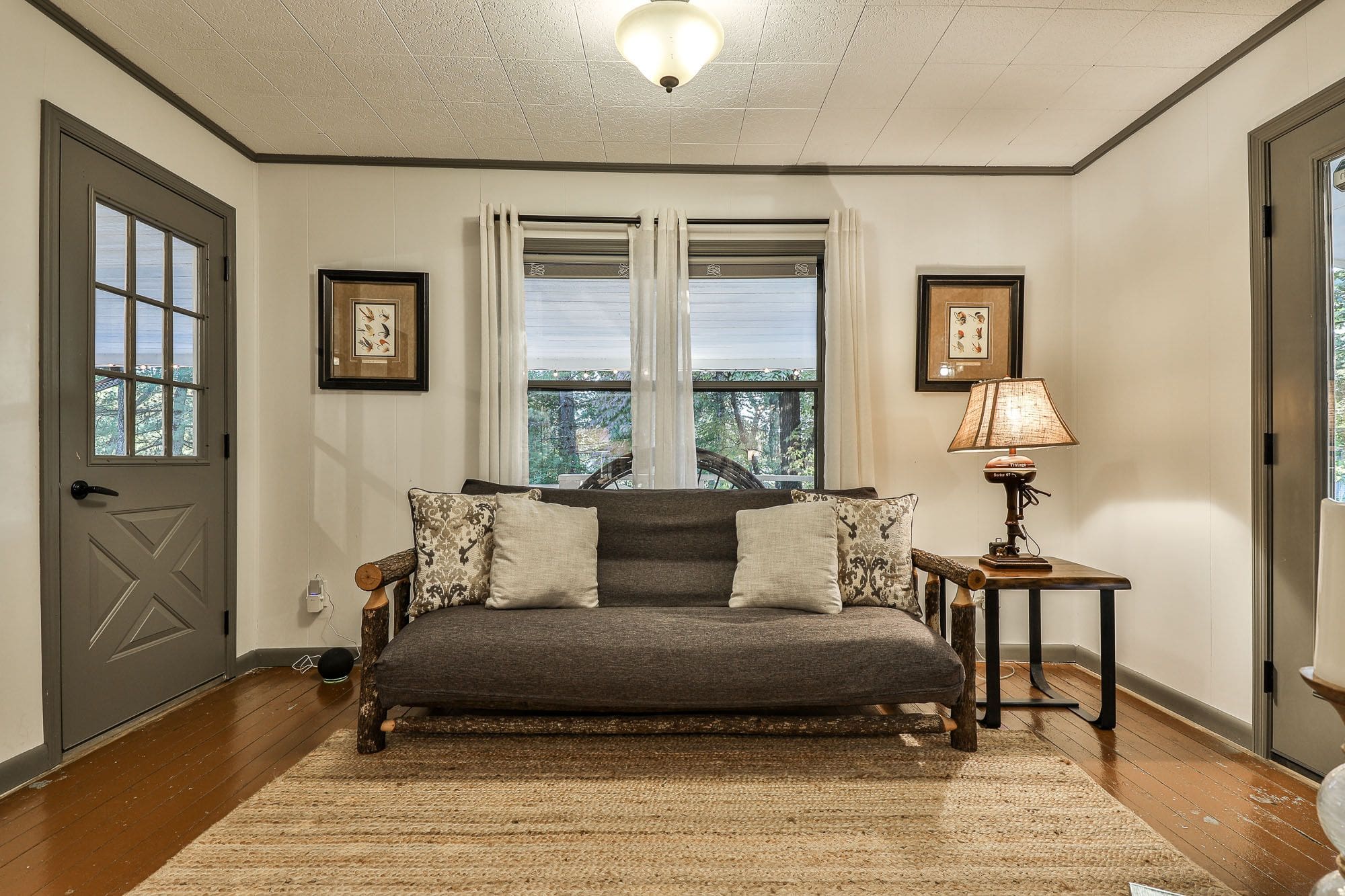 A living room with two lamps and a couch