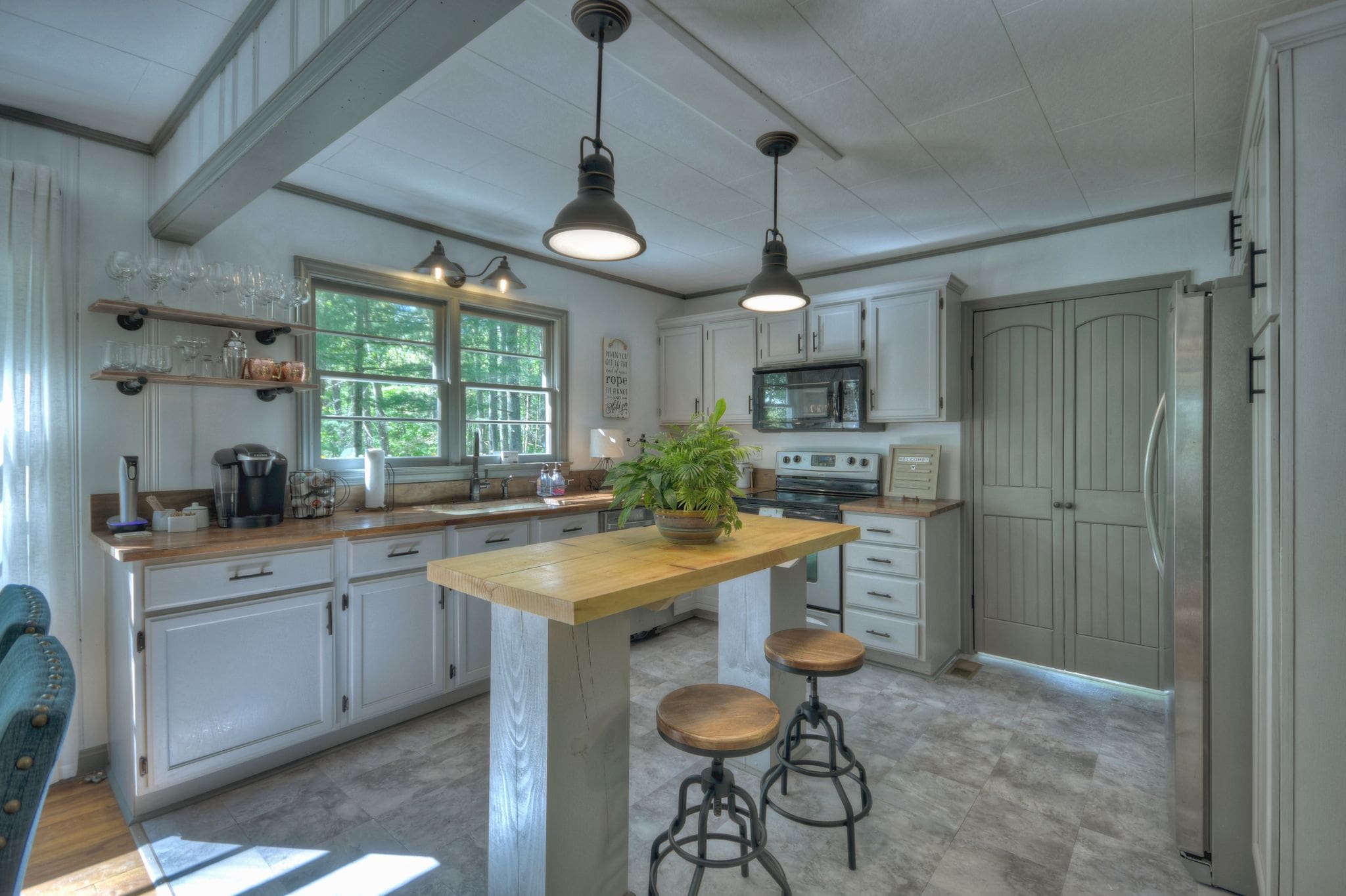 A kitchen with a table and chairs in it