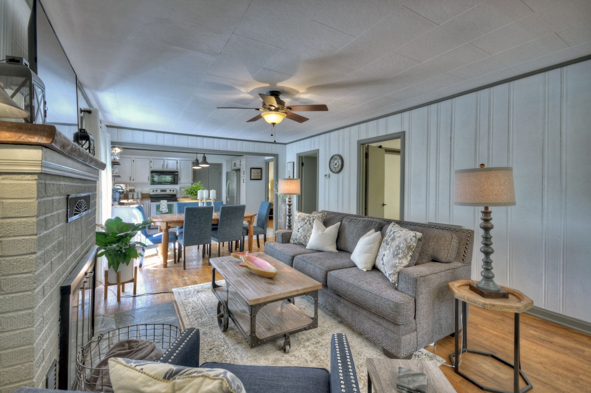 A living room with couches and tables in it